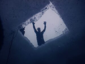 Hole in frozen swimming pool